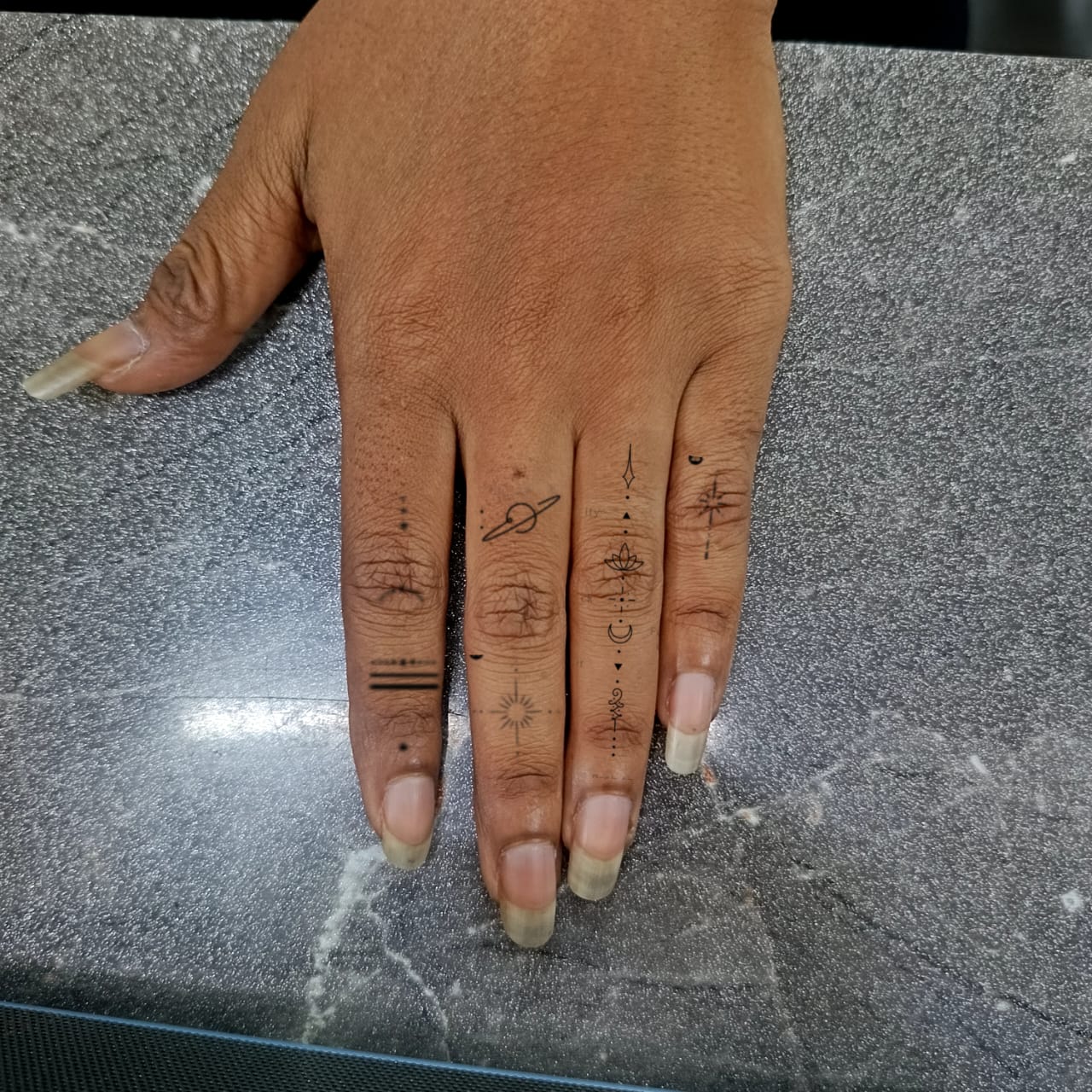 finger small tattoo